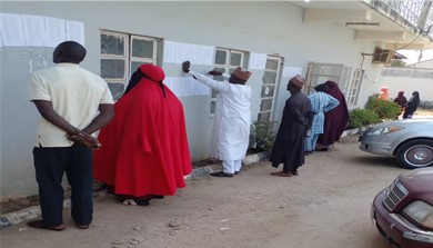 Students verify their names on the new list of 03 beneficiaries at the Bauchi State Ministry of Health.