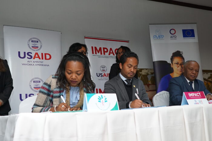 Signature of the partnership agreement between (left to right) DPLMT, IMPACT, and FMFP. 